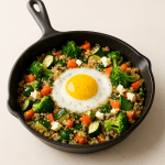 Savory Quinoa and Egg Breakfast Skillet with Mixed Veggies and Feta